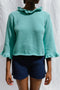 FIORELLA ruffle jumper / organic cotton / turquesa